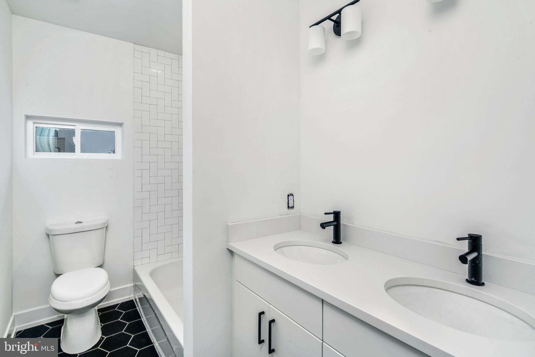 1527-29 Ridge Avenue, Unit 3A Philadelphia, PA 19130 - Photo 24 of 33 a bathroom with a sink toilet and mirror
