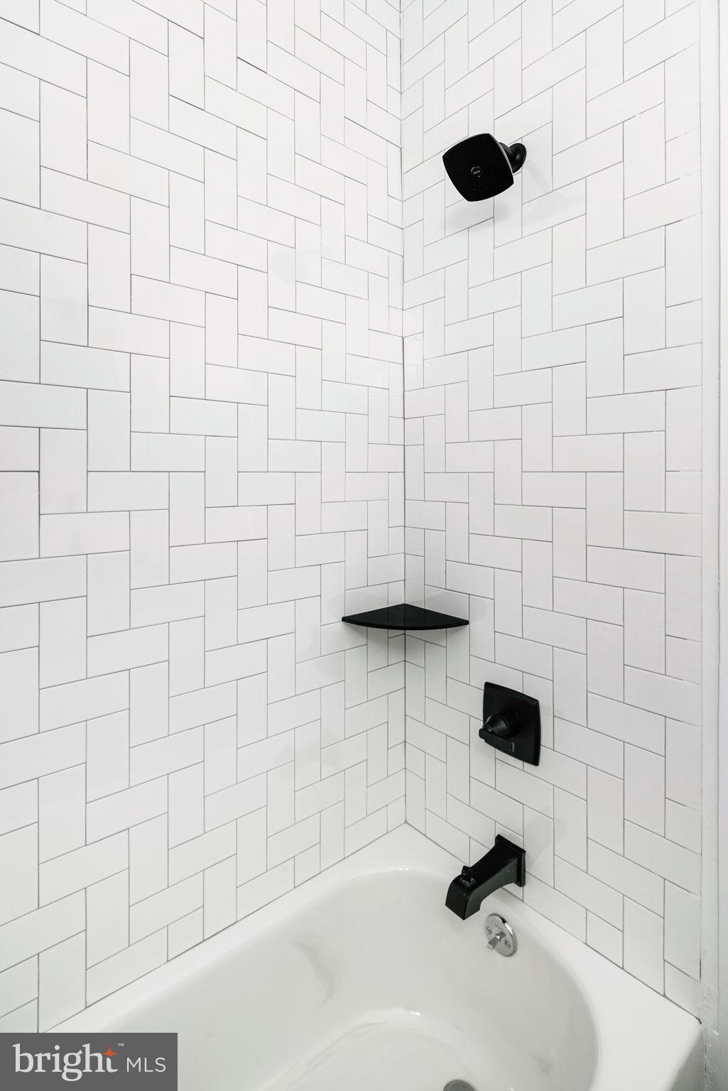 1527-29 Ridge Avenue, Unit 3A Philadelphia, PA 19130 - Photo 28 of 33 a bathroom with a shower