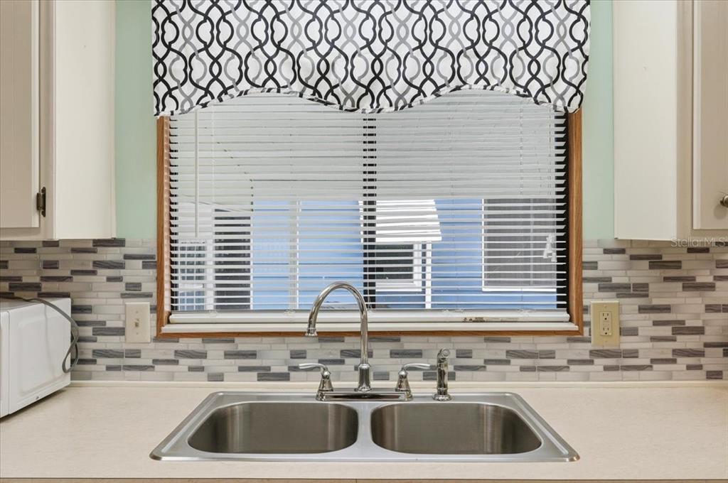 1798 Fox Hill Drive Lakeland, FL 33810 - Photo 11 of 41 a kitchen with a sink a stove and cabinets