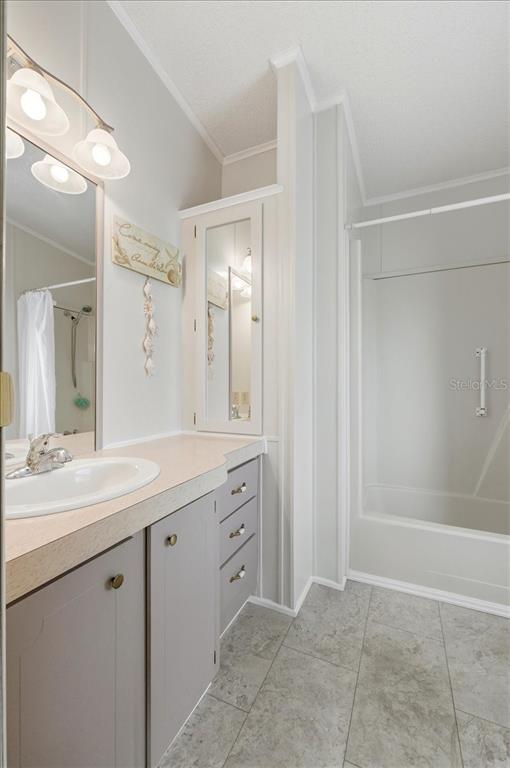 1798 Fox Hill Drive Lakeland, FL 33810 - Photo 17 of 41 a spacious bathroom with a granite countertop sink mirror and a