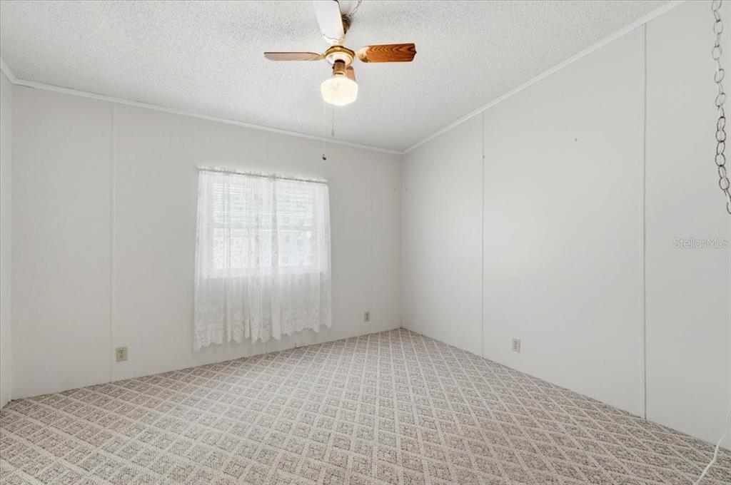 1798 Fox Hill Drive Lakeland, FL 33810 - Photo 21 of 41 wooden floor in an empty room with a window