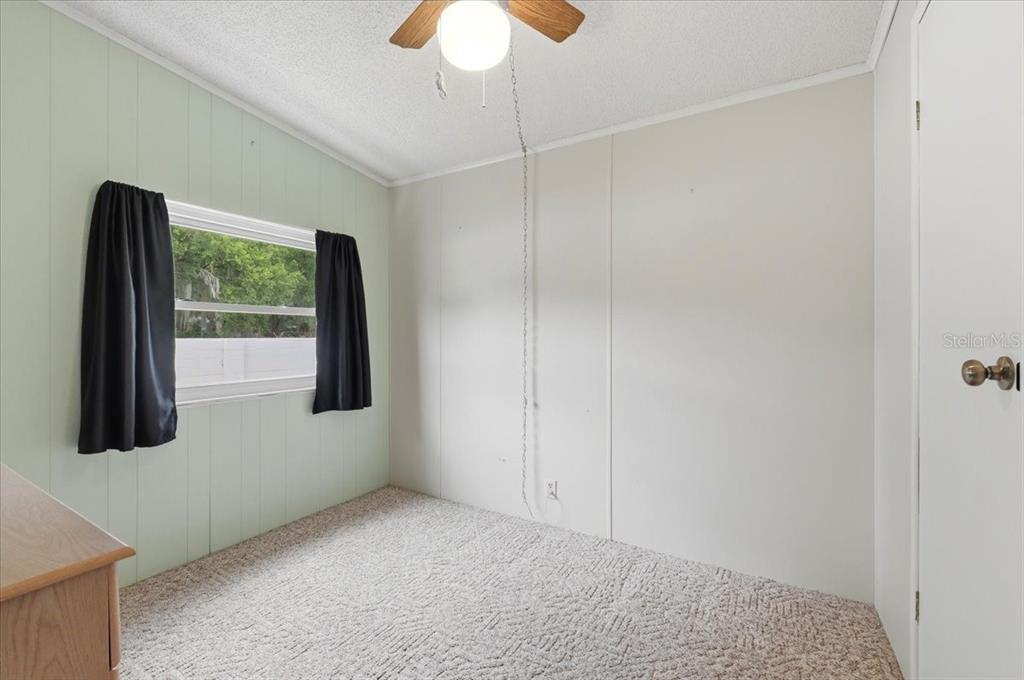 1798 Fox Hill Drive Lakeland, FL 33810 - Photo 23 of 41 a view of a room with a window and ceiling fan