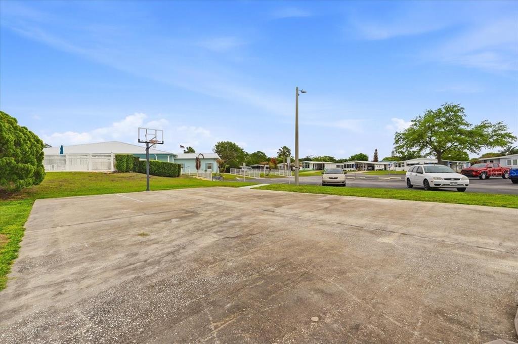 1798 Fox Hill Drive Lakeland, FL 33810 - Photo 33 of 41 a view of a house with a big yard and palm trees