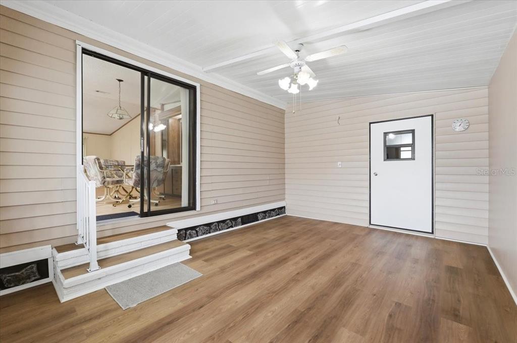 1798 Fox Hill Drive Lakeland, FL 33810 - Photo 4 of 41 a view of an empty room with wooden floor and a window