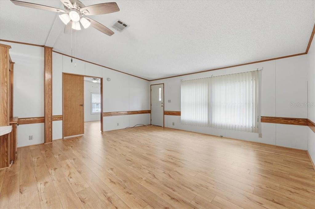 1798 Fox Hill Drive Lakeland, FL 33810 - Photo 8 of 41 a view of an empty room with wooden floor and a window
