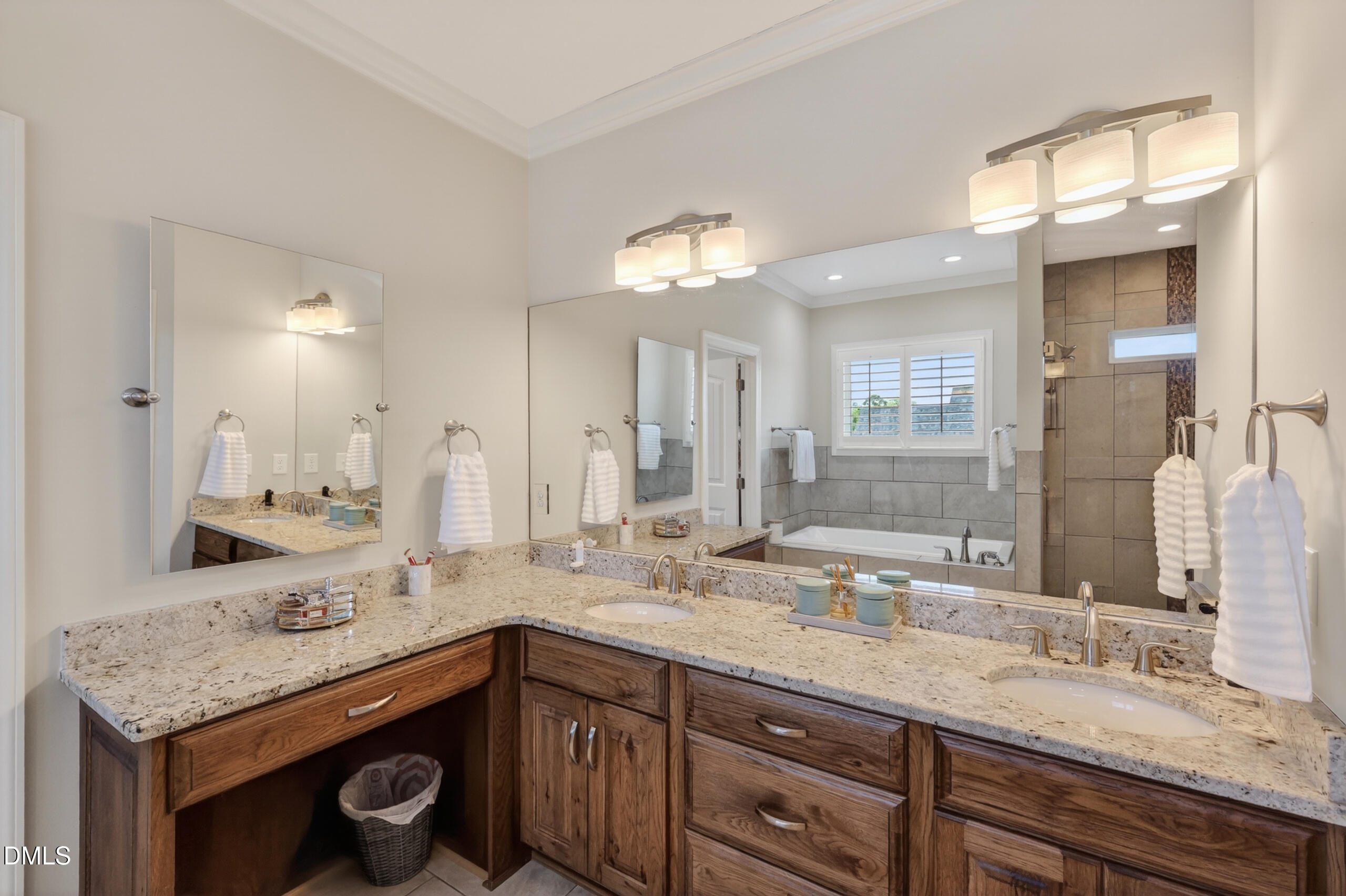 261 Character Drive Rolesville, NC 27571 - Photo 36 of 77 a bathroom with a sink double vanity and a mirror