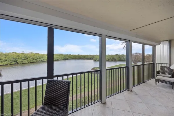 a view of a balcony with lake and mountain view