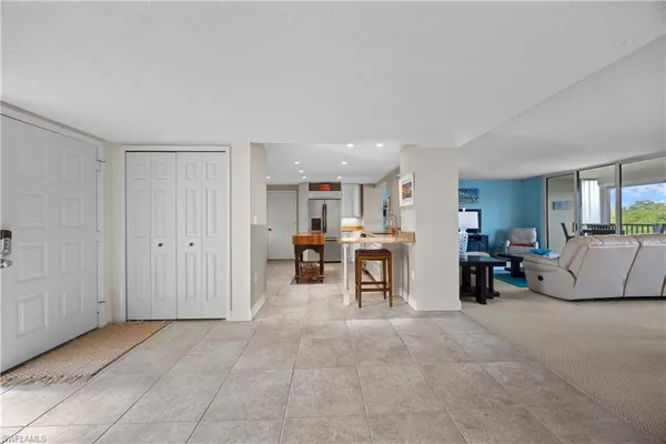 a view of a livingroom with furniture and a window