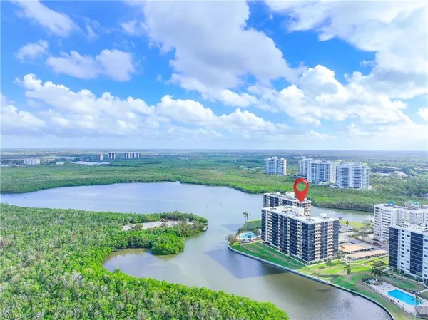 a view of a yard with a lake view