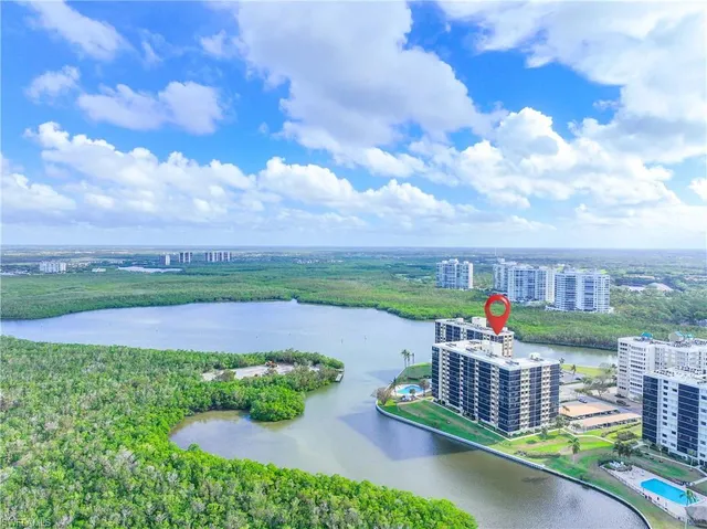 a view of a yard with a lake view
