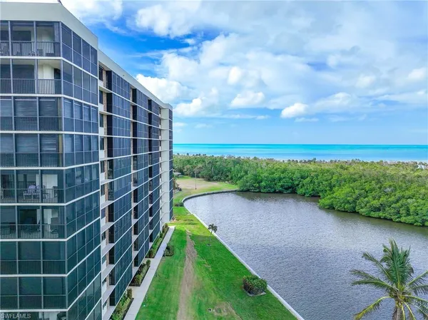 a view of a city with tall buildings and a big yard