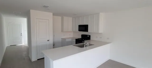 a room with a sink and a mirror