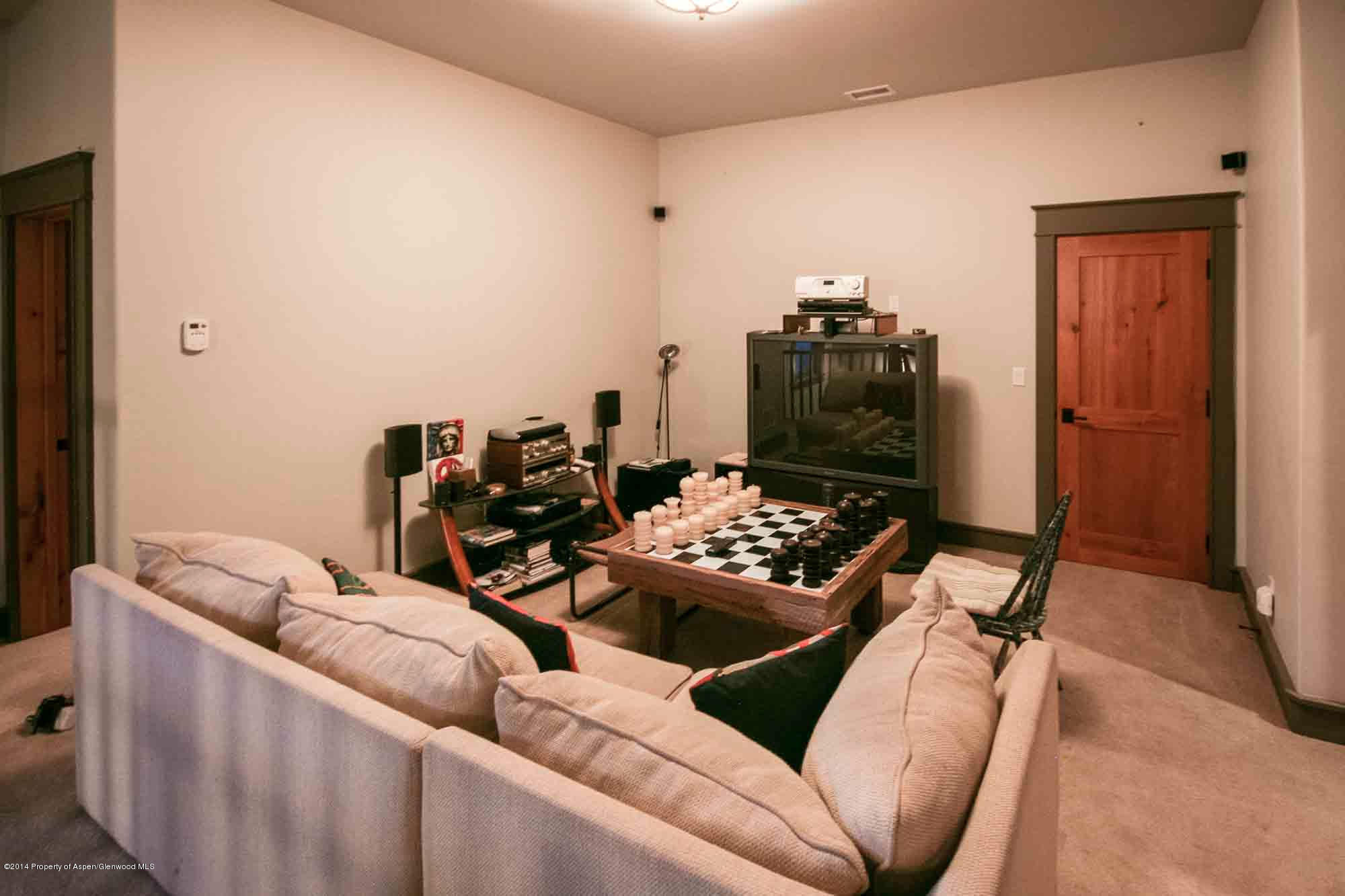 210 Diamond A Ranch Road Carbondale, CO 81623 - Photo 14 of 14 a living room with furniture and wooden floor