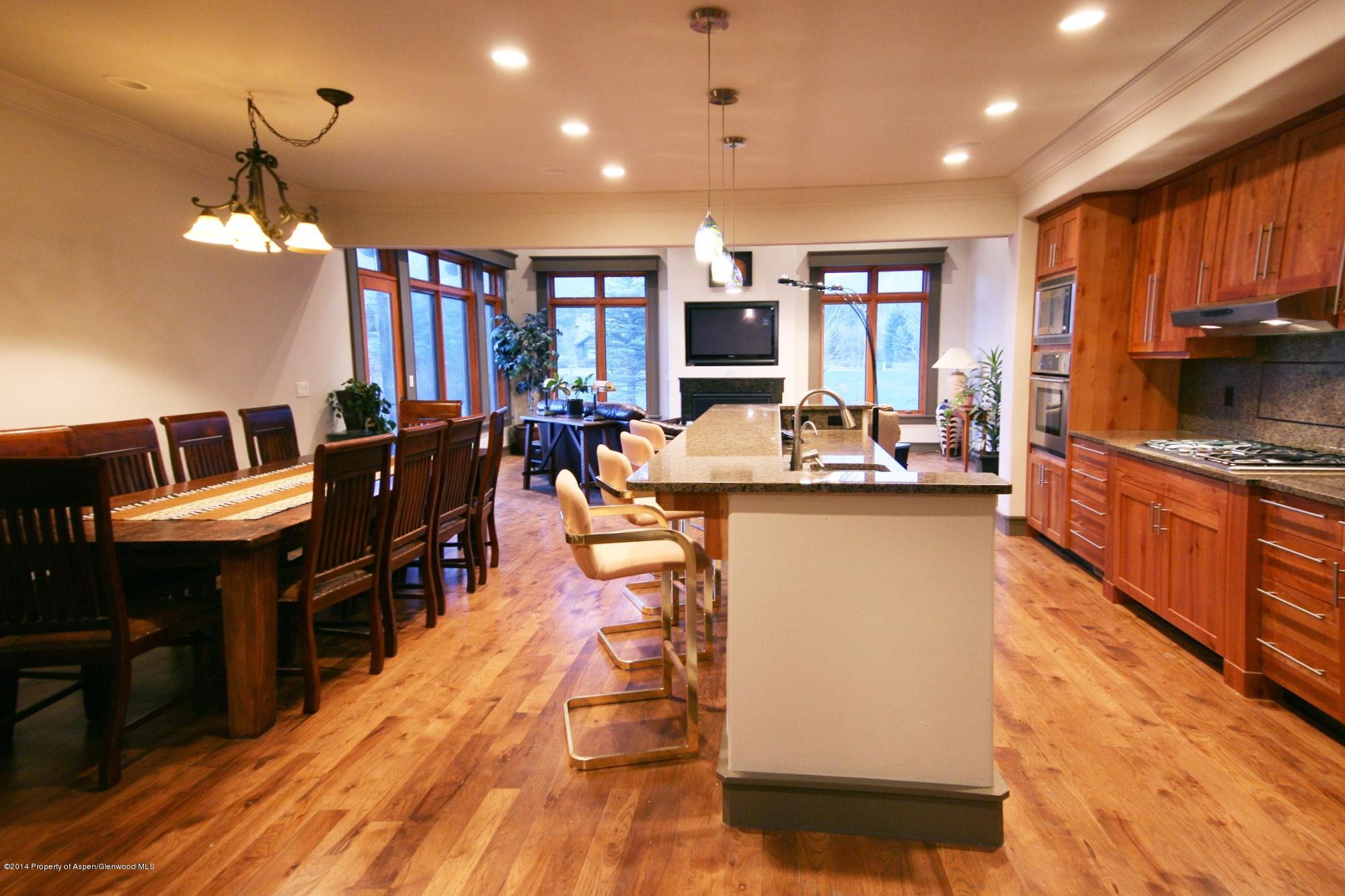 210 Diamond A Ranch Road Carbondale, CO 81623 - Photo 6 of 14 a living room with stainless steel appliances kitchen island granite countertop furniture and a kitchen view