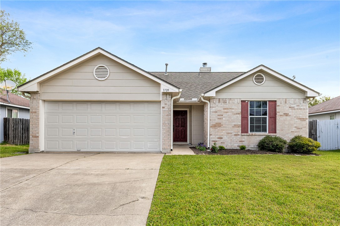 3709 Springfield Drive College Station, TX 77845 - Photo 1 of 23 a front view of a house with garden