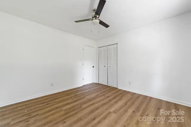 a view of room with wooden floor