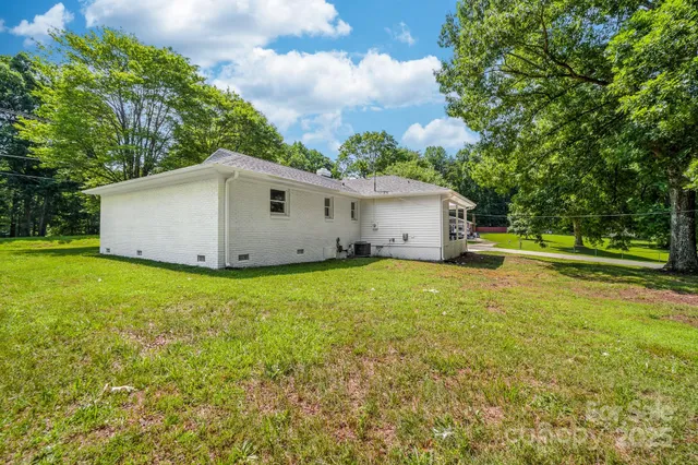 a house with trees in the background