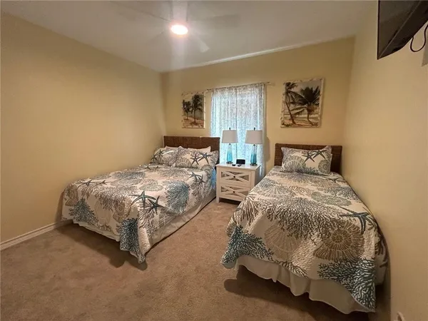 a bedroom with double bed and a window