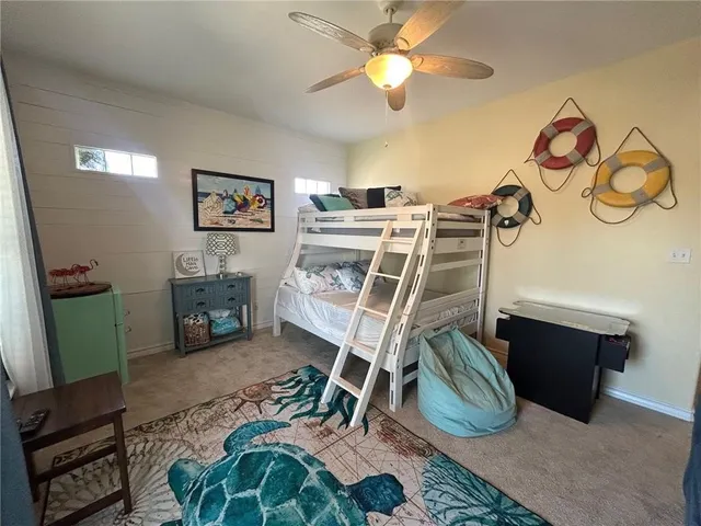 a view of a livingroom with furniture and a flat screen tv