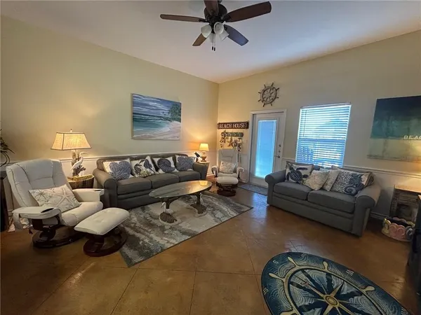 a living room with furniture and a window