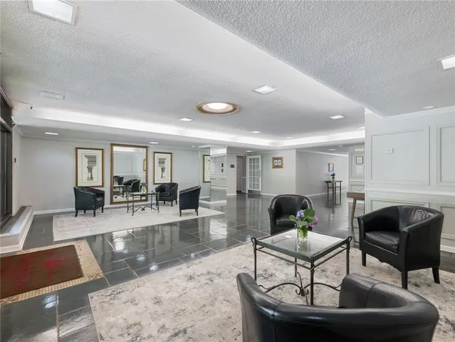 a living room with furniture and a table