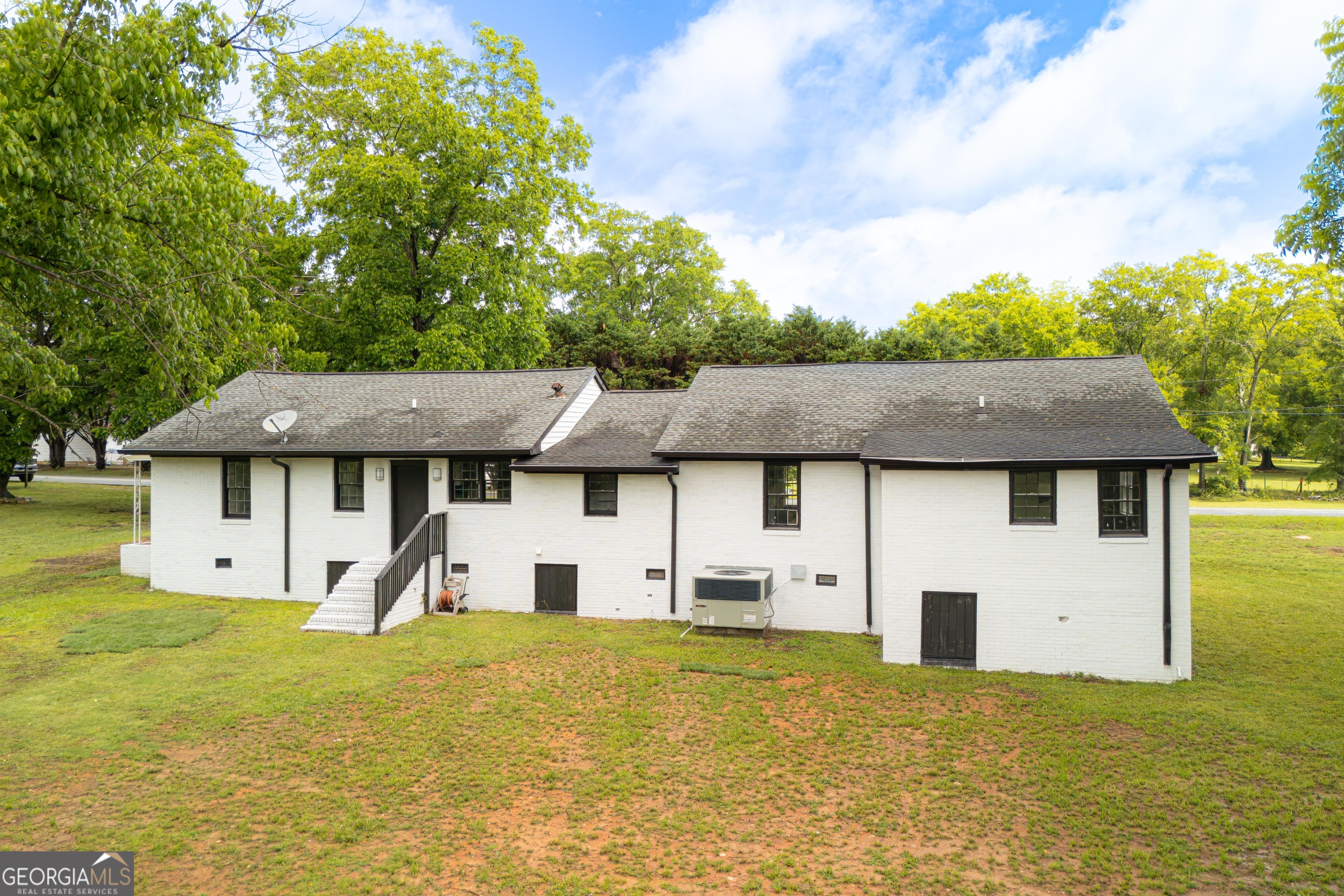 418 Lamb Road Moreland, GA 30259 - Photo 26 of 32 a front view of a house with a yard