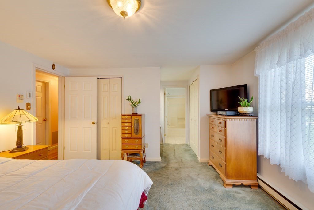 55 Wrentham Road Worcester, MA 01602 - Photo 16 of 30 a bedroom with a bed and a flat screen tv