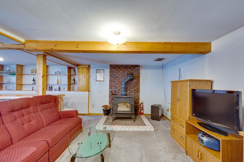 55 Wrentham Road Worcester, MA 01602 - Photo 20 of 30 a living room with furniture and a flat screen tv