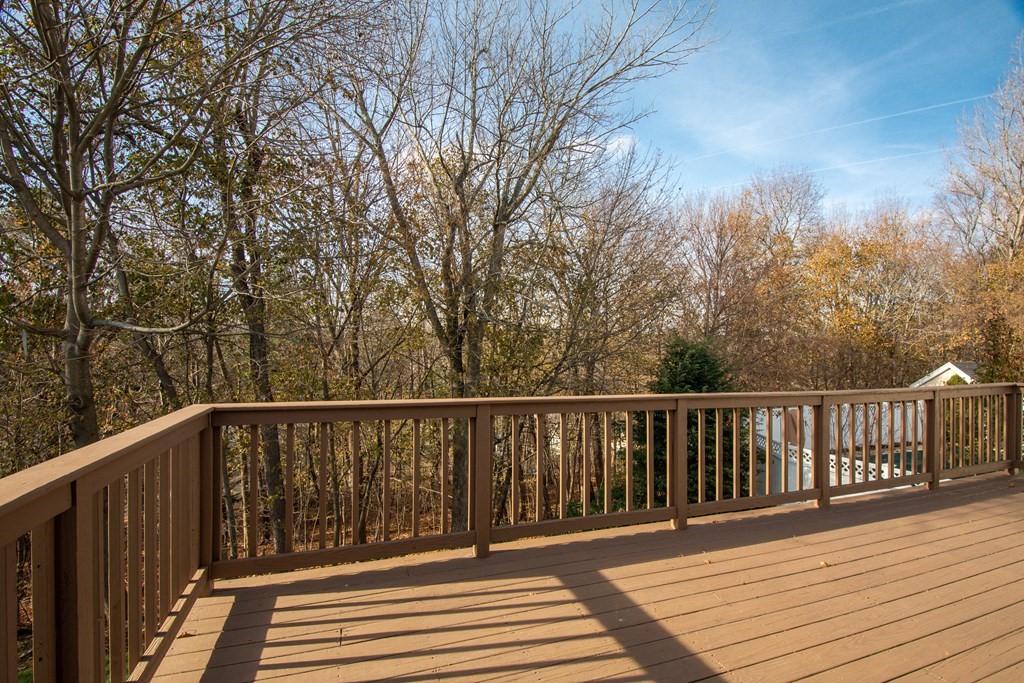 55 Wrentham Road Worcester, MA 01602 - Photo 25 of 30 a balcony with wooden floor and fence