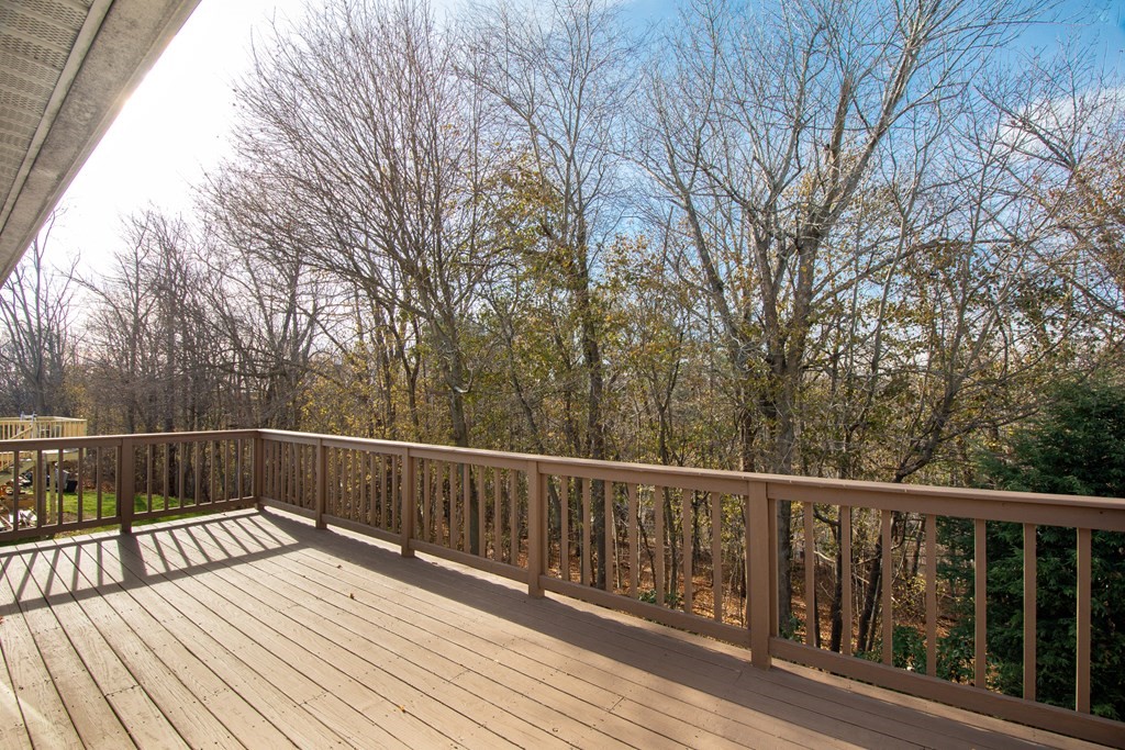 55 Wrentham Road Worcester, MA 01602 - Photo 26 of 30 a view of balcony with wooden floor and fence