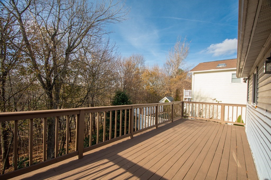 55 Wrentham Road Worcester, MA 01602 - Photo 27 of 30 a view of balcony with wooden floor and fence