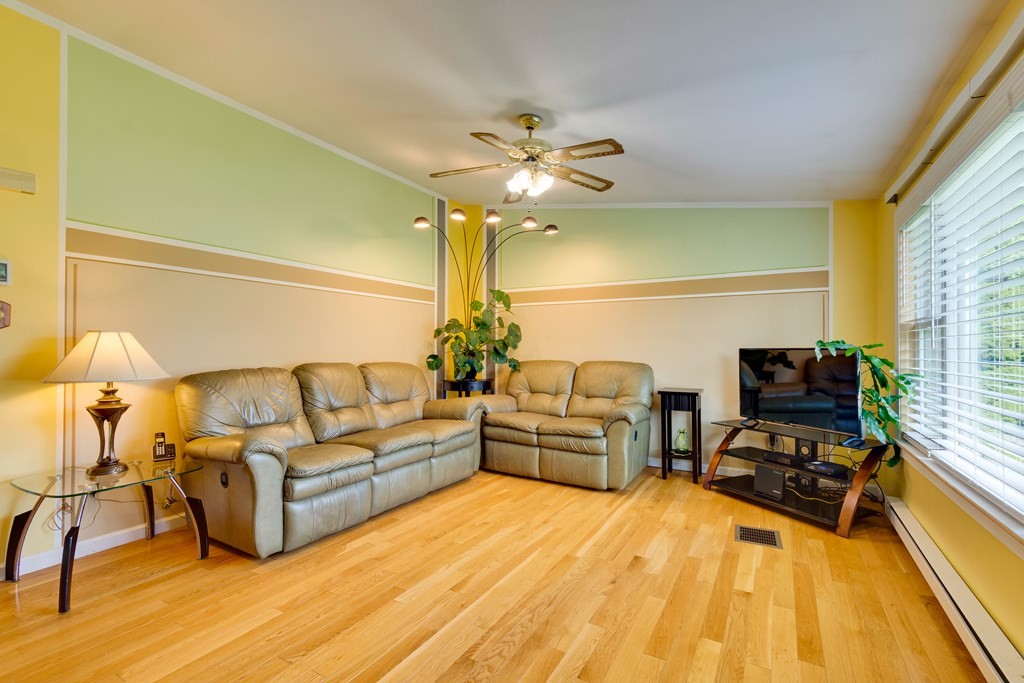 55 Wrentham Road Worcester, MA 01602 - Photo 4 of 30 a living room with furniture and a flat screen tv
