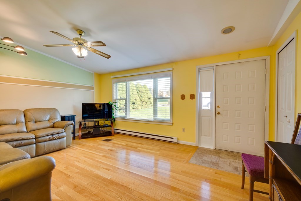 55 Wrentham Road Worcester, MA 01602 - Photo 5 of 30 a living room with furniture and a flat screen tv