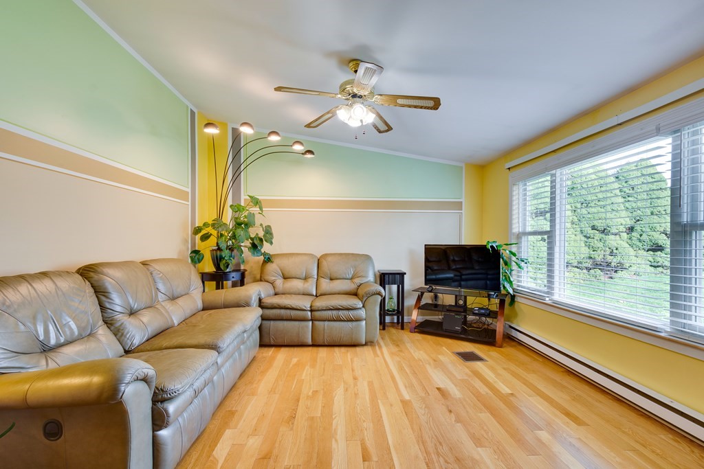 55 Wrentham Road Worcester, MA 01602 - Photo 6 of 30 a living room with furniture and a large window