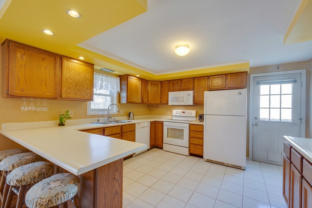 55 Wrentham Road Worcester, MA 01602 - Photo 10 of 30 a kitchen with a refrigerator and a sink