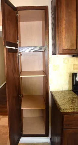 a kitchen view with a refrigerator and counter