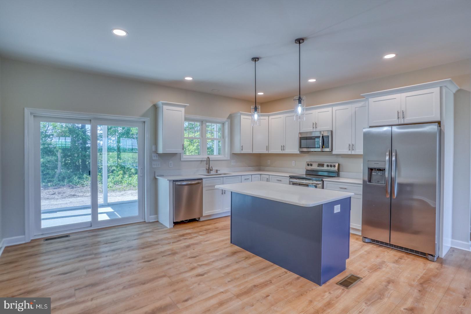 15720 Old Furnace Road Georgetown, DE 19947 - Photo 11 of 28 The island color is actually dark gray.