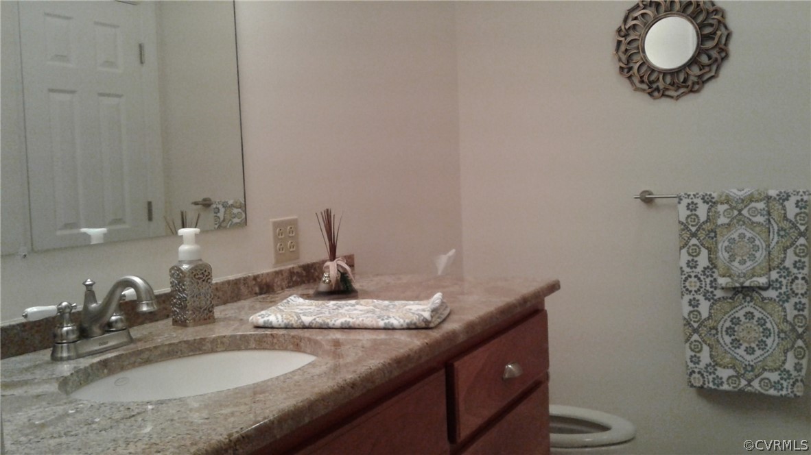1863 Buffalo Road Dillwyn, VA 23936 - Photo 12 of 27 a bathroom with a granite countertop sink and a mirror