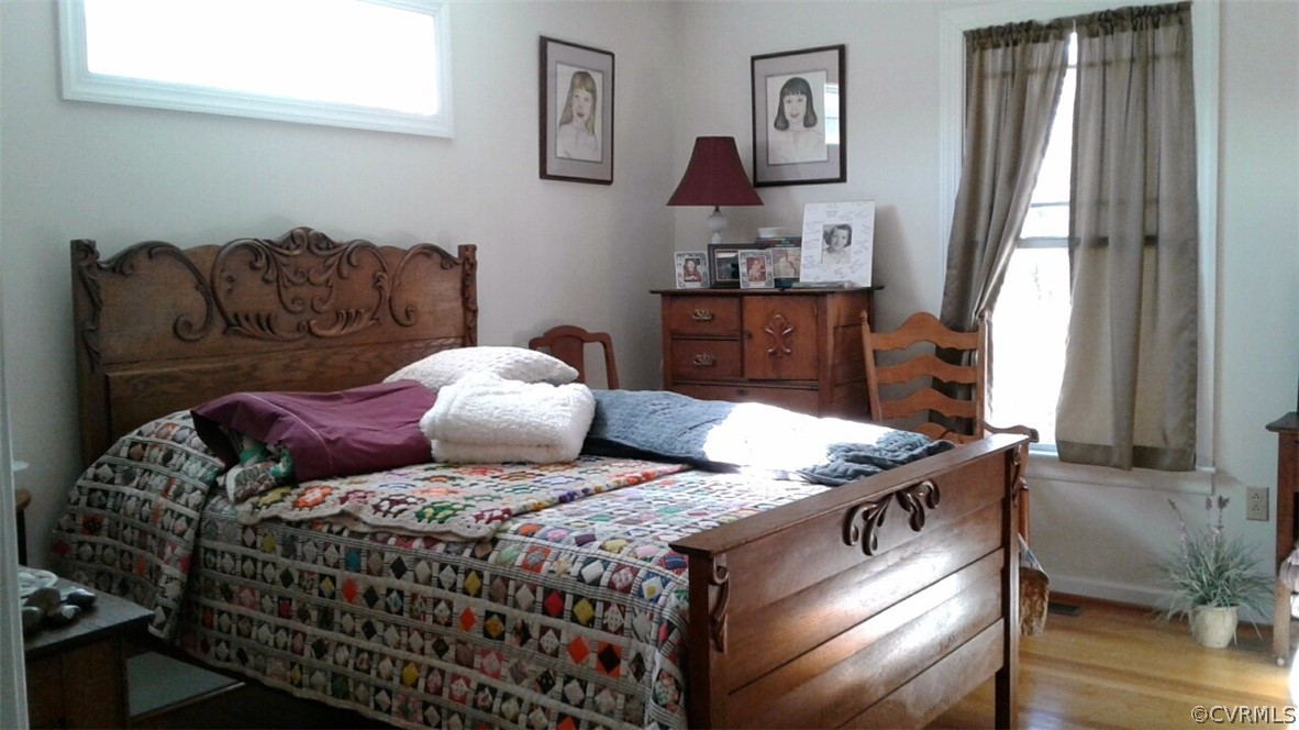 1863 Buffalo Road Dillwyn, VA 23936 - Photo 14 of 27 a bed sitting in a bedroom next to a window with pc on the table