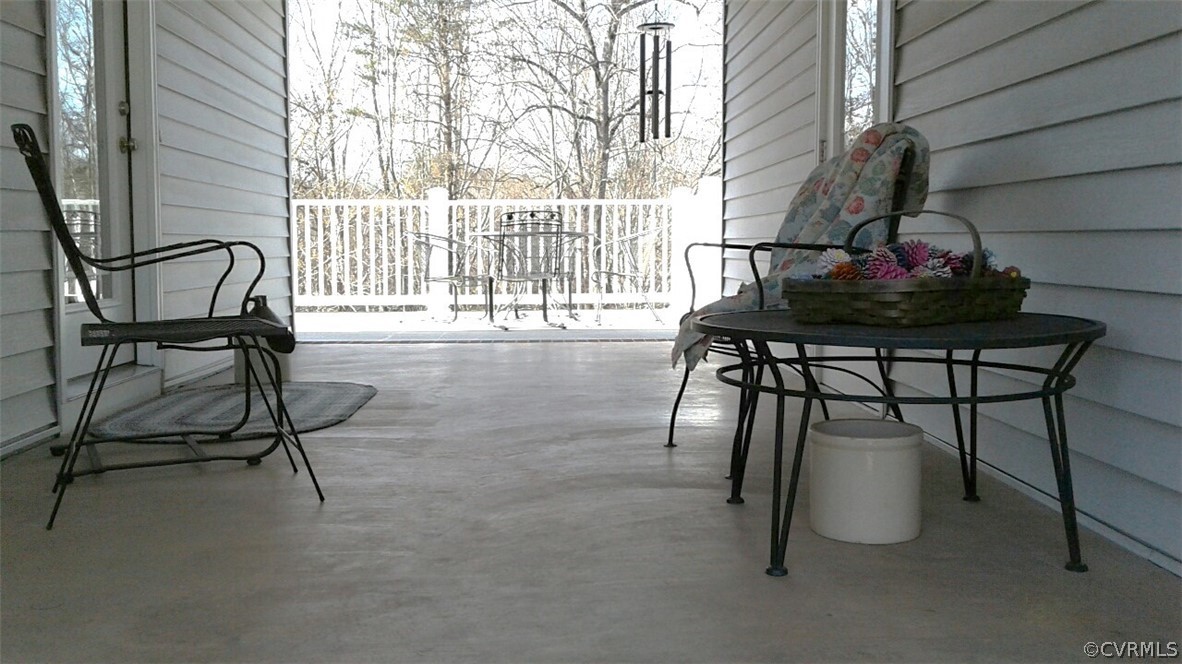 1863 Buffalo Road Dillwyn, VA 23936 - Photo 15 of 27 a view of a patio with a table and chairs and potted plants
