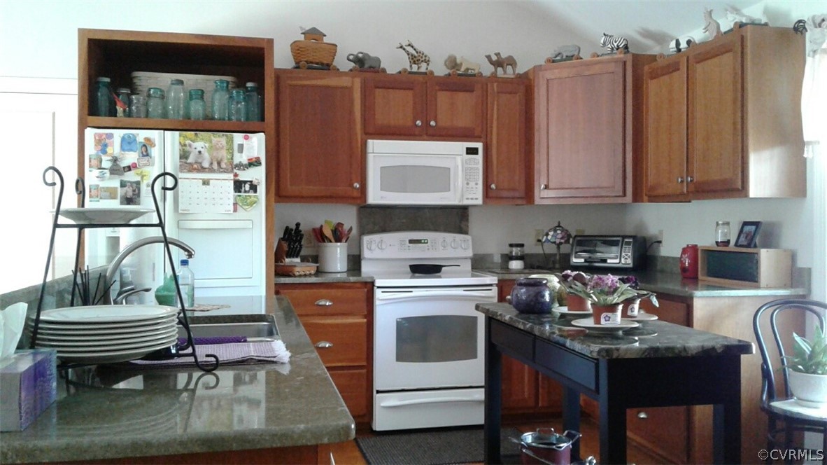 1863 Buffalo Road Dillwyn, VA 23936 - Photo 3 of 27 a kitchen with a refrigerator and a stove top oven