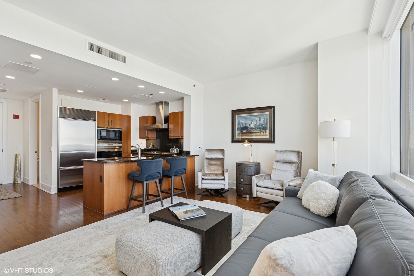 401 North Wabash Avenue, Unit 59B Chicago, IL 60611 - Photo 15 of 40 a living room with furniture kitchen view and a wooden floor