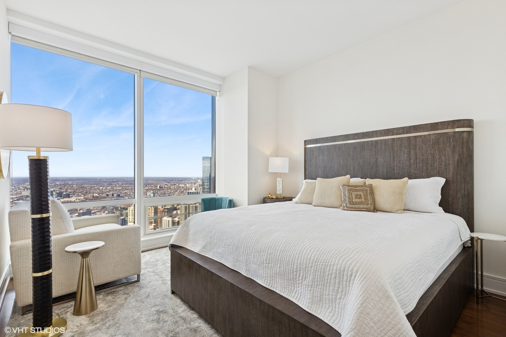 401 North Wabash Avenue, Unit 59B Chicago, IL 60611 - Photo 17 of 40 a bedroom with a bed lamp and window
