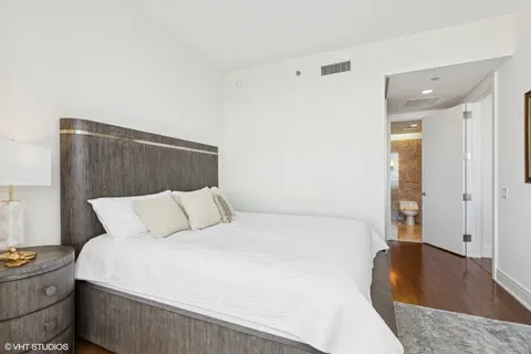 a large bed in a white room