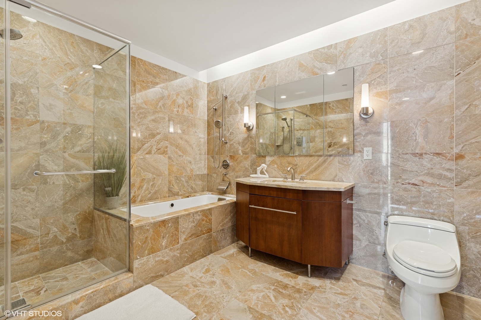 401 North Wabash Avenue, Unit 59B Chicago, IL 60611 - Photo 19 of 40 a bathroom with a sink a toilet and shower