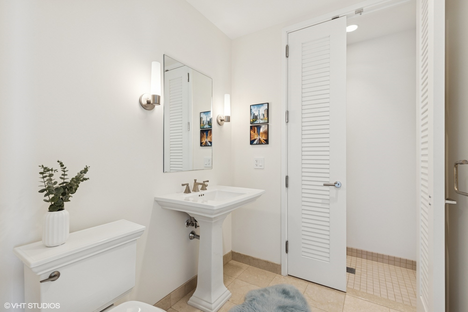 401 North Wabash Avenue, Unit 59B Chicago, IL 60611 - Photo 6 of 40 a bathroom with a sink a toilet and shower