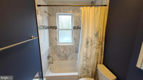 a bathroom with a toilet and a sink
