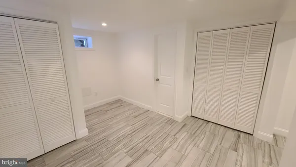 a bathroom with a toilet a sink and shower