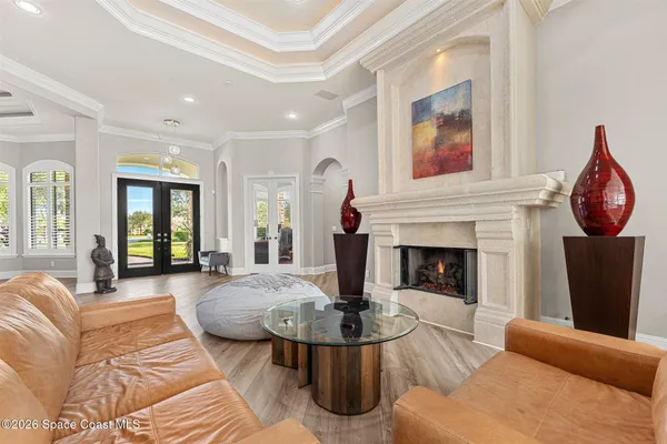 a view of a dining room with furniture wooden floor and chandelier