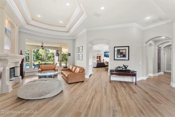 a view of a livingroom with workspace and a window